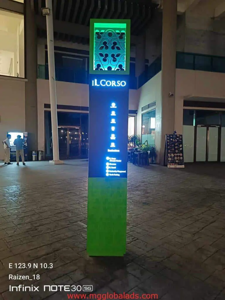 Illuminated pylon sign for iL CORSO at night in an outdoor mall, Ortigas. Modern signage by M&G Global Ads.
