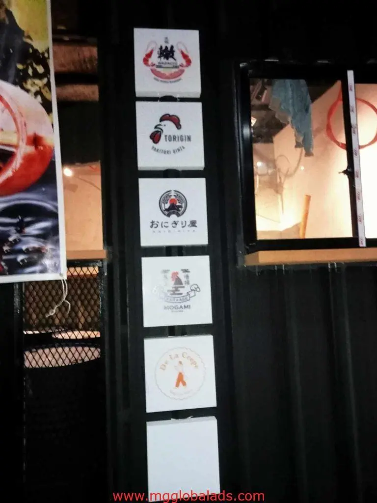 Restaurant metallic signage featuring five logos in English and Japanese, Makati exterior install by M&G Global Ads.