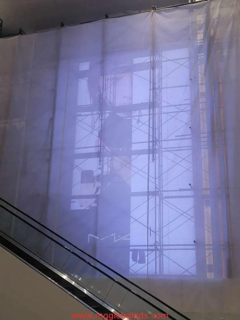 LED billboard signage installation with scaffolding and escalator at building site in Ortigas, by M&G Global Ads.