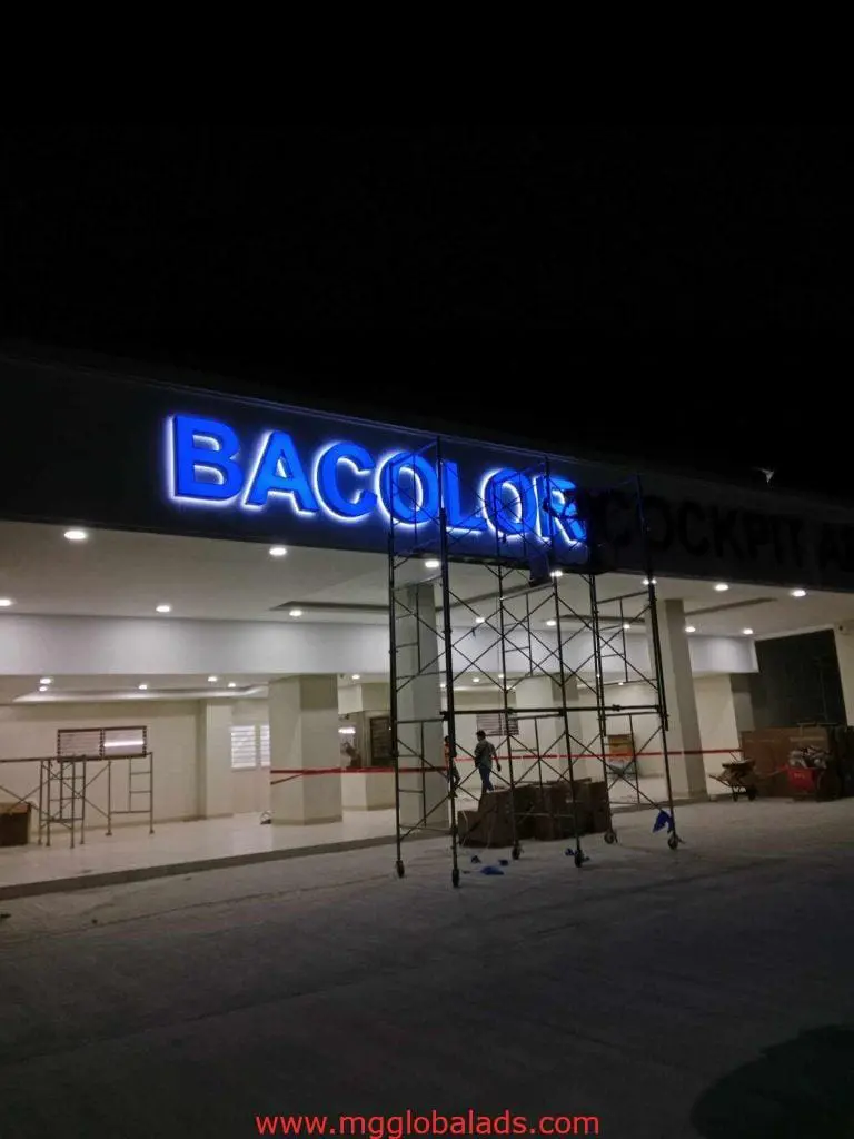 LED signage installation for BACOLOR client on building facade in Makati at night, by M&G Global Ads.