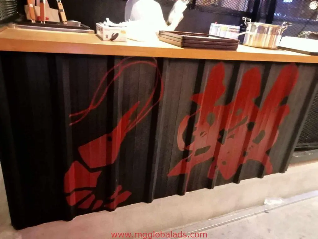 Japanese food stall outdoor signage for restaurant client in Mandaluyong—shrimp design, utensils on counter by M&G Global Ads.