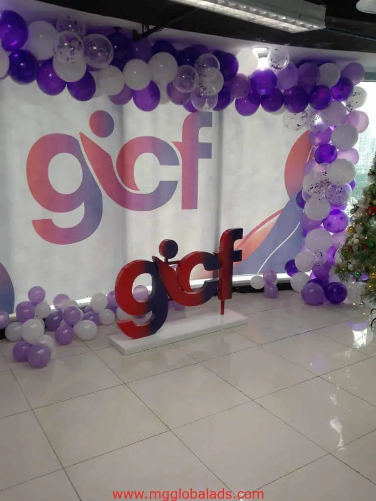 LED event signage with GICF logo, purple and white balloons in Makati indoor venue, glossy floor by M&G Global Ads.