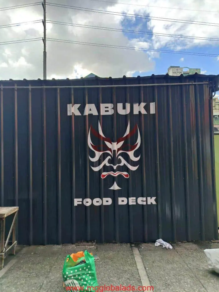 Restaurant signage for Kabuki Food Deck featuring a kabuki mask, wall view in BGC. by M&G Global Ads.