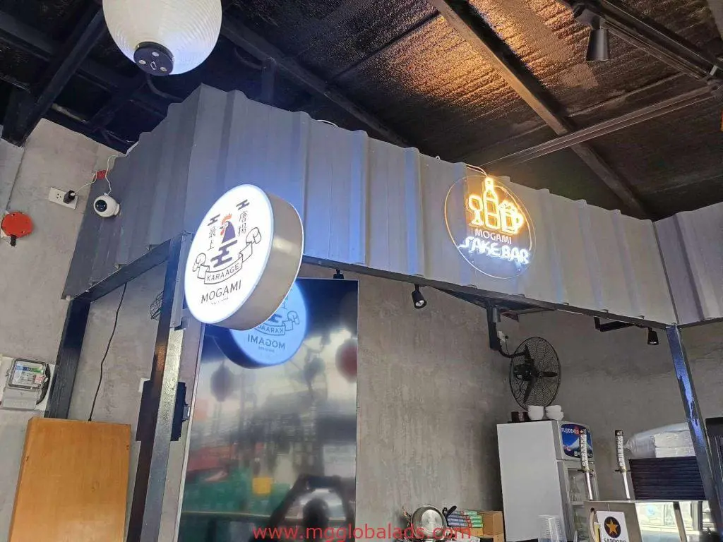 Mogami illuminated acrylic signage and neon sign at a modern sake bar in Makati by M&G Global Ads.