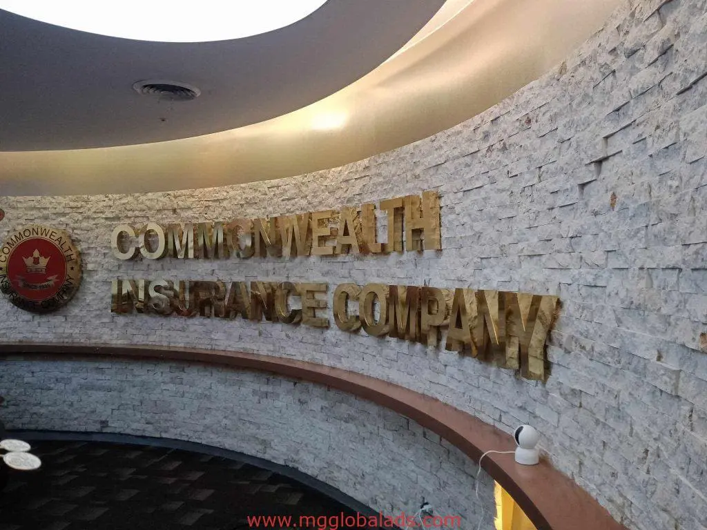 Metallic office lobby signage for Commonwealth Insurance Company in Makati with LED logo by M&G Global Ads.