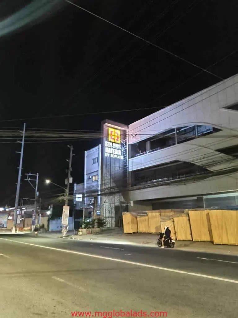 LED signage for START SATELLITE BY FORTUNE on a nighttime street in Makati, motorbike, rider, power lines by M&G Global Ads.