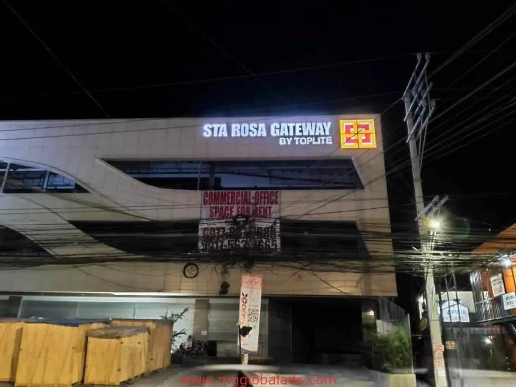 Illuminated LED signage for STA ROSA GATEWAY by Toplite in Makati, office space banner visible, power lines in front, by M&G Global Ads.