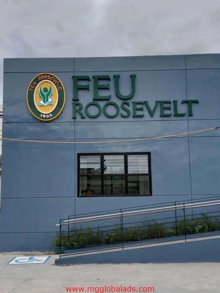 FEU Roosevelt outdoor building signage in Cubao with green and gold logo and large lettering above a window by M&G Global Ads.