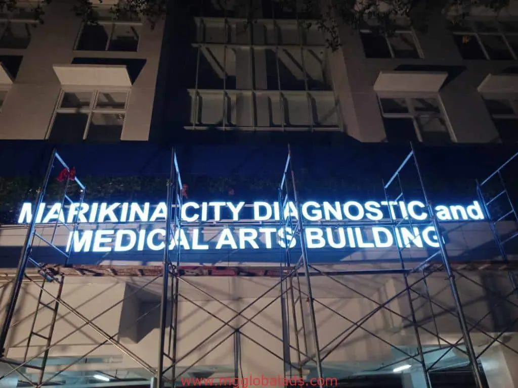 LED signage for Marikina City Diagnostic and Medical Arts Building in Ortigas at night with scaffolding, by M&G Global Ads.