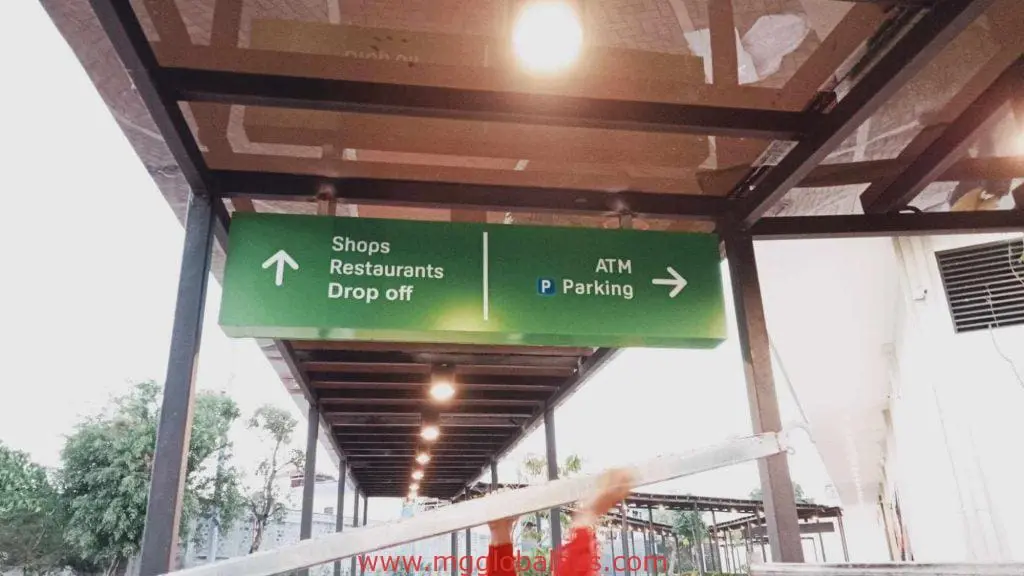 Outdoor directional signage for shops, restaurants, drop off, ATM, and parking in Makati by M&G Global Ads.