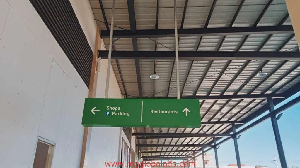 Indoor LED directional signage in Makati covered walkway for shops, parking, and restaurants by M&G Global Ads.