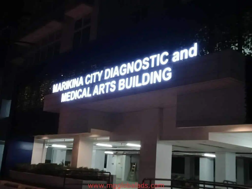 Acrylic signage for Marikina City Diagnostic and Medical Arts Building in Ortigas, building exterior at night by M&G Global Ads.