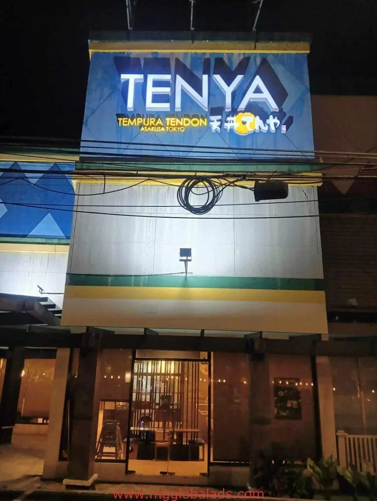 Acrylic signage for Tenya Tempura Tendon restaurant, Makati, visible at night above entrance by M&G Global Ads.