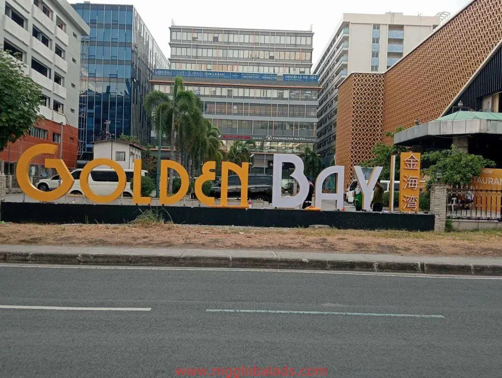 Golden Bay metallic LED signage at a restaurant entrance in Makati city street, commercial building by M&G Global Ads.