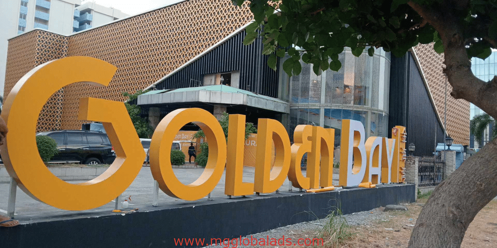 Golden Bay yellow metallic 3D sign letters outdoor signage at modern building, Quezon City, by M&G Global Ads.