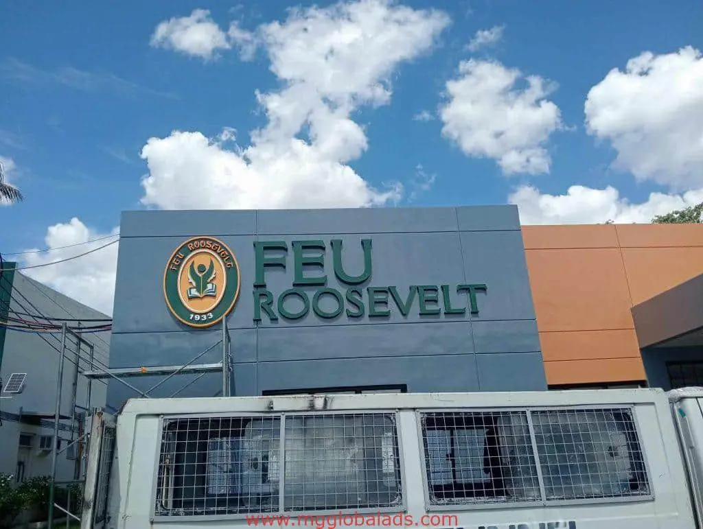 Acrylic signage for FEU Roosevelt with Est. Roosevelt 1933 logo; facade view in Quezon City by M&G Global Ads.