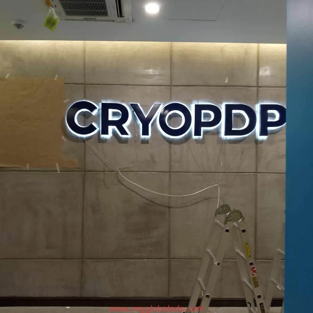 Illuminated LED signage CRYOPDP installation in Makati with exposed wires and ladder, by M&G Global Ads.