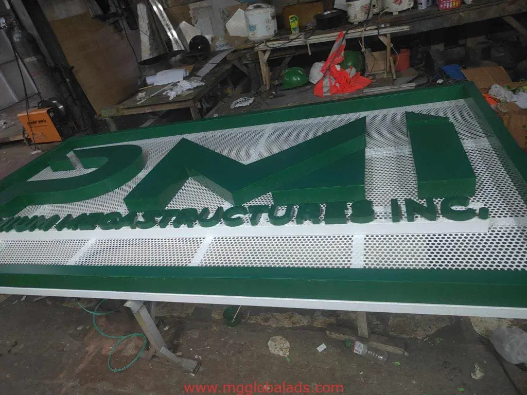PMI INFRASTRUCTURE INC. metal building signage fabrication in a workshop, Ortigas location, by M&G Global Ads.
