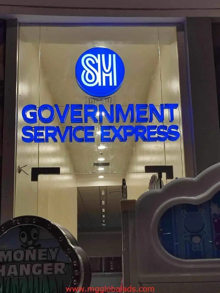 Illuminated LED signage for SM Government Service Express at a glass entrance in Quezon City by M&G Global Ads.