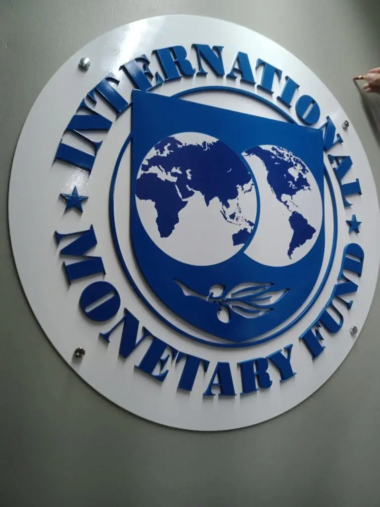 Round metallic building signage for International Monetary Fund in Makati, blue and white logo, by M&G Global Ads.