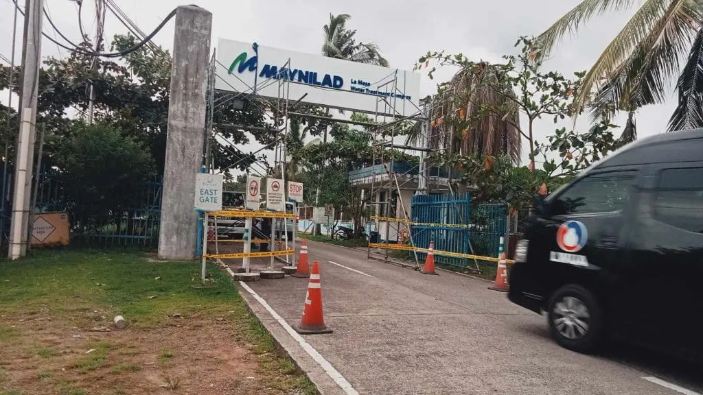 Maynilad East Gate building entrance signage in Pasig, with van and cones, by M&G Global Ads.
