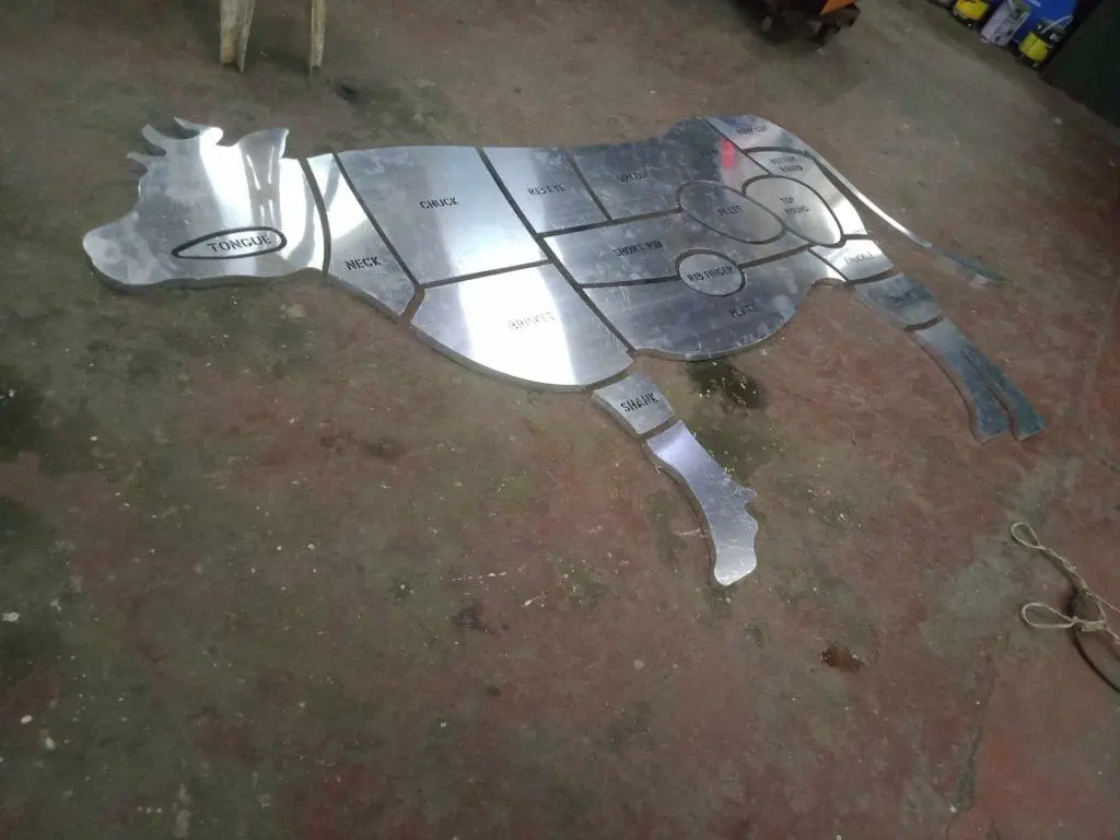Metallic beef cuts sign for restaurant, showcasing cow diagram, photographed in Makati. Custom signage by M&G Global Ads.