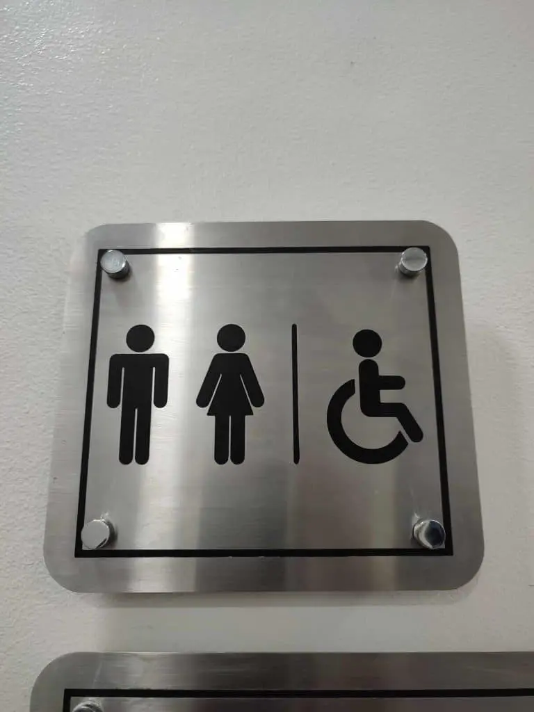 stainless engrave restroom signage for inclusive bathrooms with men, women, and accessible icons in Ortigas by M&G Global Ads.
