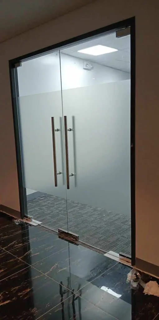 Glass double doors, LED signage for office, gray carpeted room in Quezon City, black floor with white streaks by M&G Global Ads.