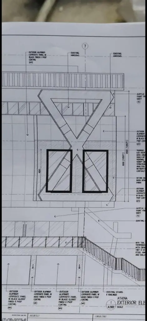 Building exterior elevation blueprint with metal signage details for Quezon City project by M&G Global Ads.
