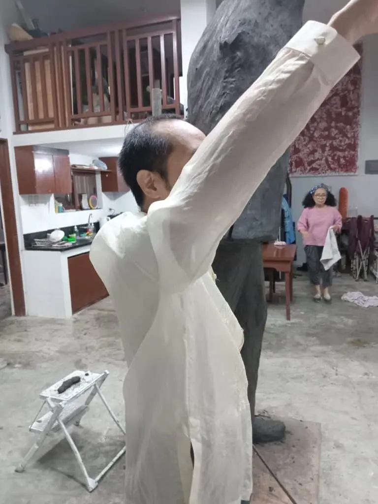 Indoor acrylic signage for client near kitchen setup in Makati, with people and decor by M&G Global Ads.