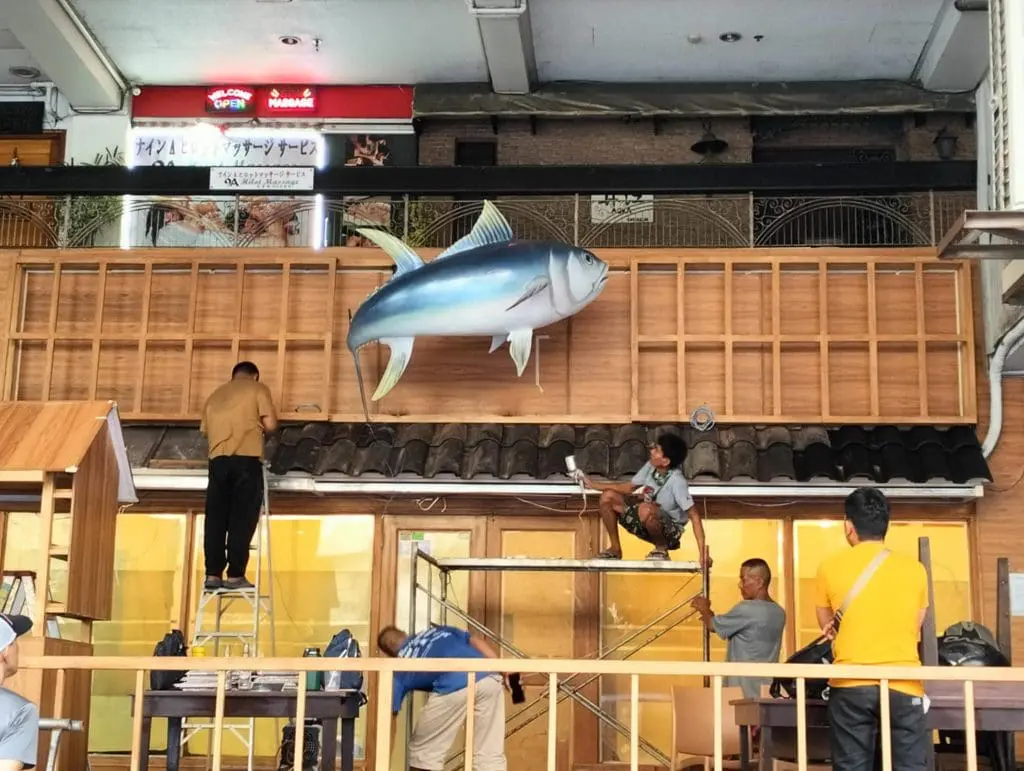 LED signage installation for seafood restaurant facade in Makati with large fish model by M&G Global Ads.
