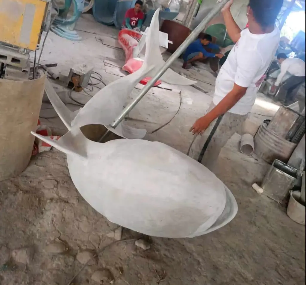 Custom outdoor 3D shark signage fabrication in a workshop in Quezon City, with artists at work, by M&G Global Ads.