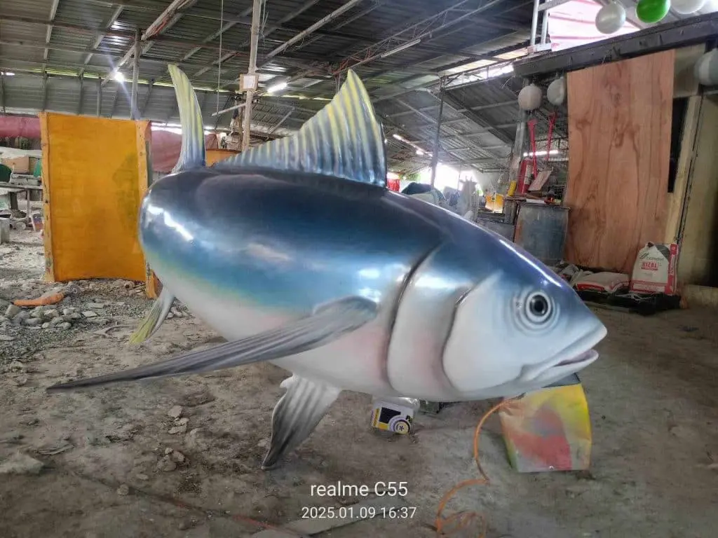 Realistic fish sculpture indoor signage in a Mandaluyong workshop, creative blue and silver design by M&G Global Ads.