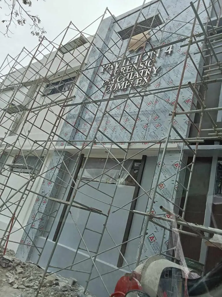 LED signage for 24/7 EMERGENCY PSYCHIATRY COMPLEX at a construction site in Quezon City by M&G Global Ads.