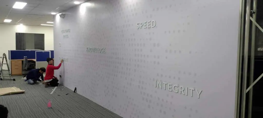 Raised office wall signage installation with words KNOWLEDGE and INTEGRITY in a bright Mandaluyong workspace by M&G Global Ads.