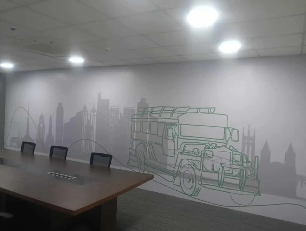 Conference room with jeepney and skyline wall mural, acrylic indoor signage in Makati, modern decor by M&G Global Ads.