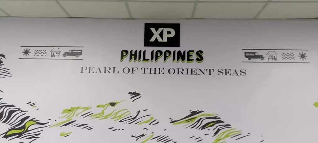 Metallic office signage for XP Philippines, Pearl of the Orient Seas in Ortigas with icons and patterns by M&G Global Ads.
