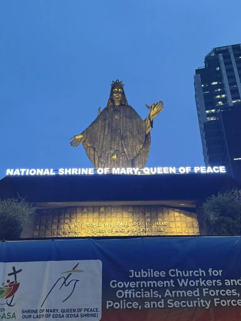 Illuminated LED church signage for National Shrine of Mary, Queen of Peace in Pasig with statue at dusk by M&G Global Ads.