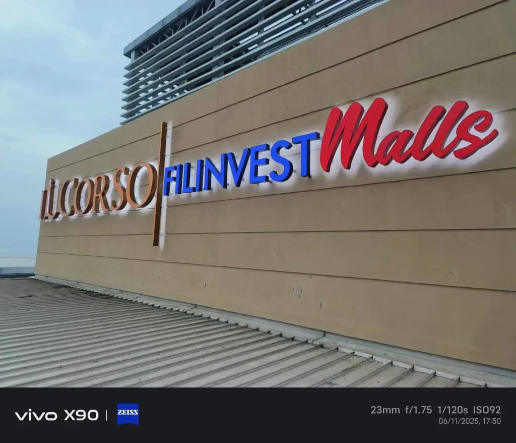 Outdoor building signage for FILINVEST Malls IL CORSO in Quezon City with cloudy sky, by M&G Global Ads.