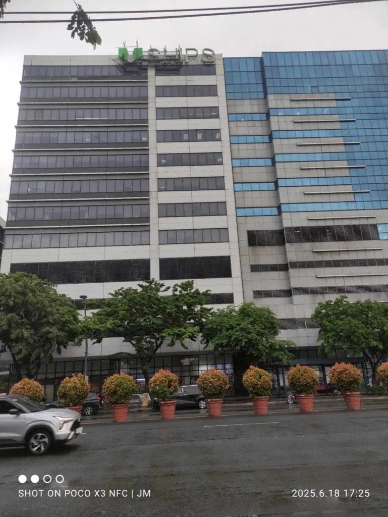 Modern office building with glass facade and outdoor building signage for Vships in Aseana by M&G Global Ads.