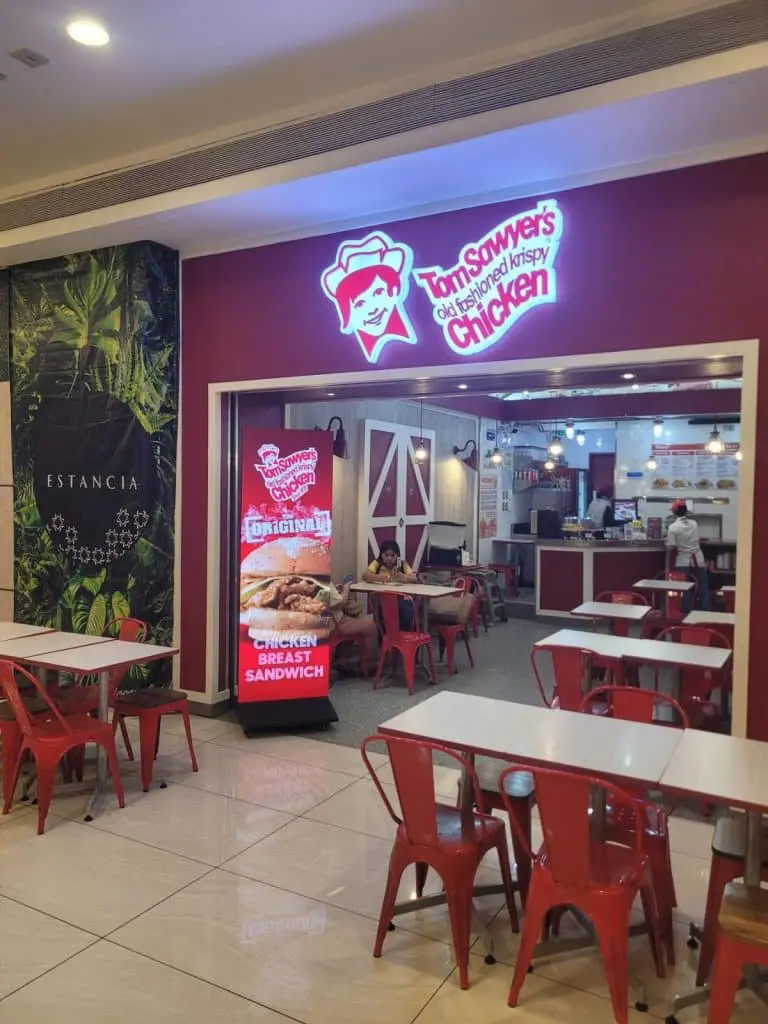 Tom Sawyer’s Old-Fashioned Krispy Chicken neon and digital signage, Quezon City mall entrance by M&G Global Ads.