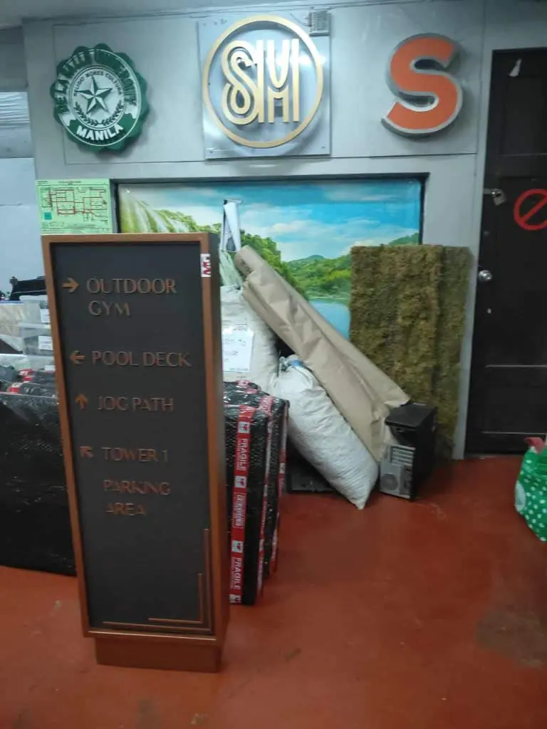 Wayfinding signage in Metro Manila directs to gym, pool, jog path, Tower 1 & parking area by M&G Global Ads.