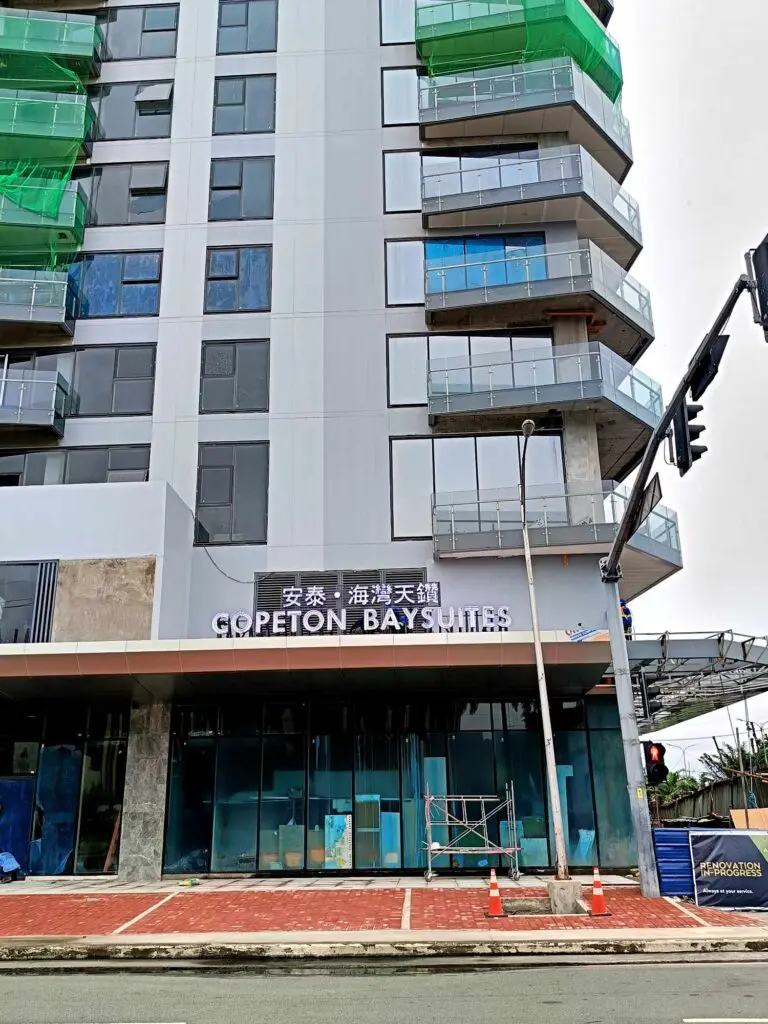 COPETON BAY SUITES hotel signage with English and Chinese text in Aseana, Pasay City, building under construction by M&G Global Ads.