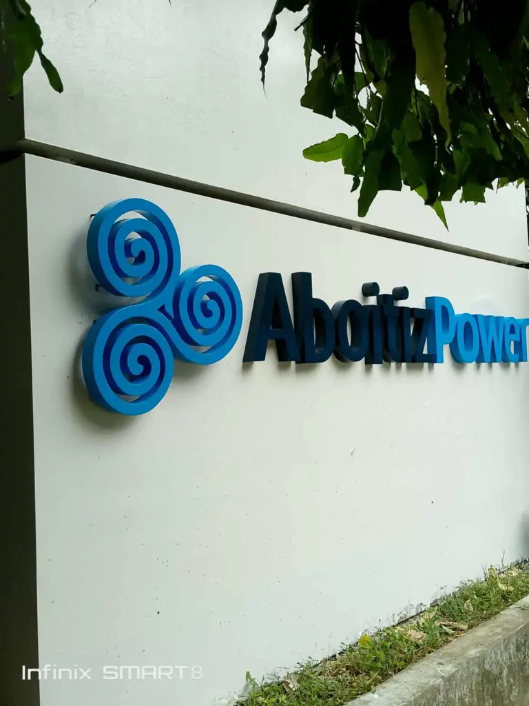 AboitizPower wall signage with logo, blue swirls, and foliage in Makati by M&G Global Ads.