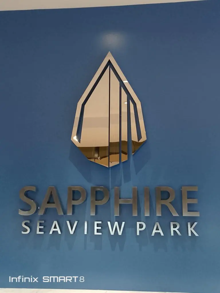SAPPHIRE SEAVIEW PARK 3D signage for Infinix, blue wall, Makati, silver geometric logo by M&G Global Ads.