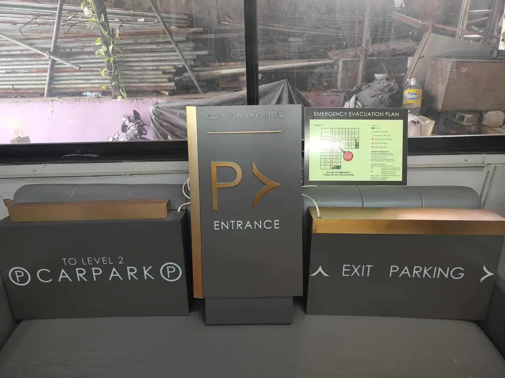 Directional car park signage with emergency evacuation plan at Mandaluyong parking area by M&G Global Ads.