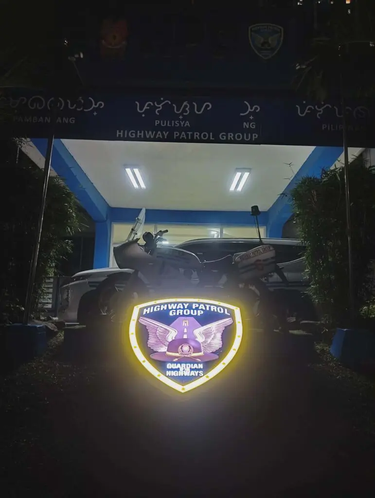 Acrylic outdoor Highway Patrol Group shield signage at Metro Manila station at night, sign maker Philippines by M&G Global Ads.