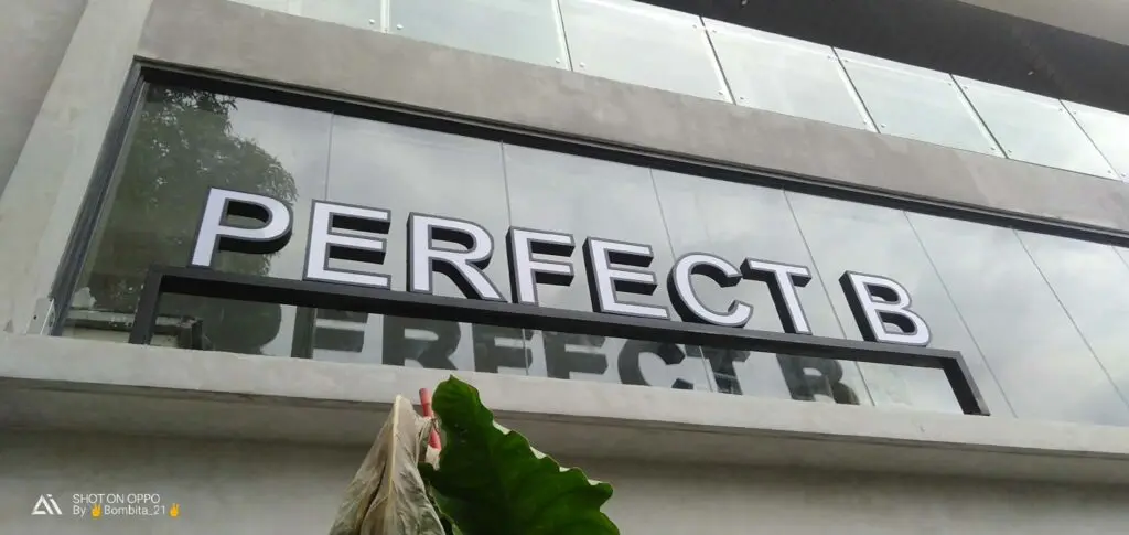 Acrylic building signage "PERFECT B" on glass and concrete exterior in Metro Manila, sign maker Philippines by M&G Global Ads.