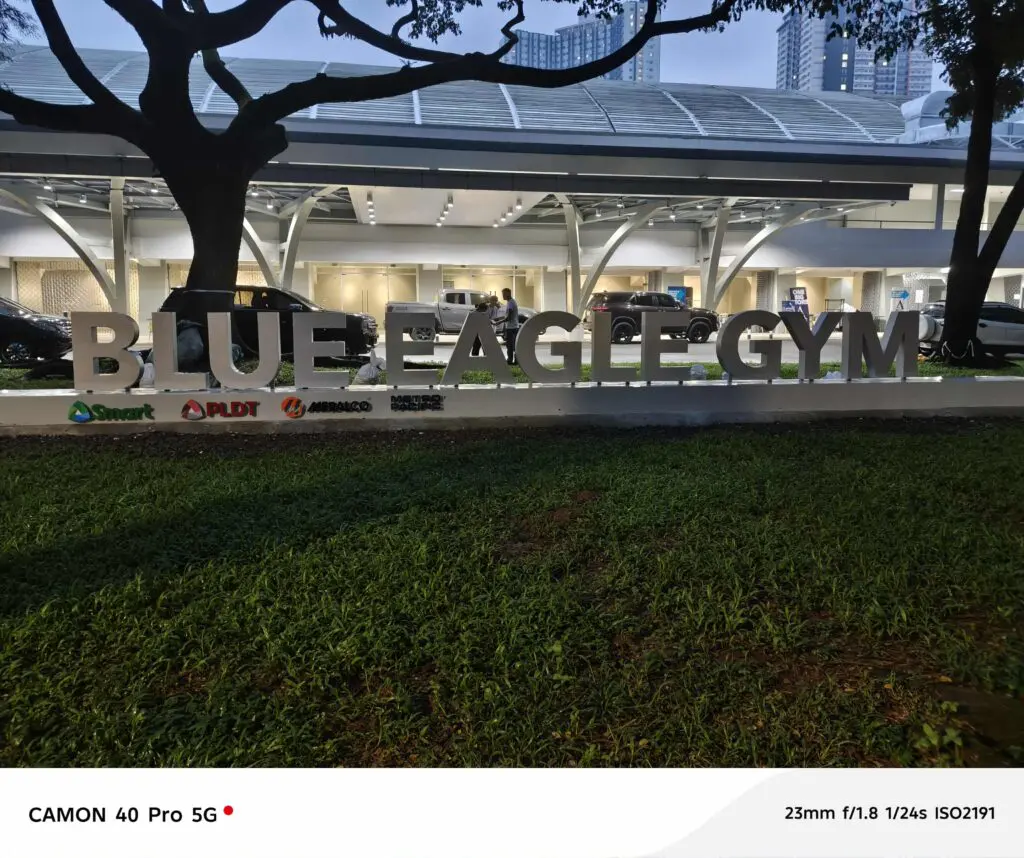 Outdoor acrylic signage for BLUE EAGLE GYM on lawn, various logos below; Metro Manila sign maker Philippines by M&G Global Ads.