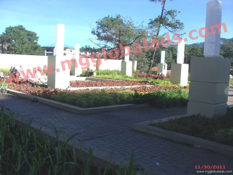 Garden area with tall, rectangular pylon pillars and building, outdoor signage, Metro Manila, sign maker Philippines by M&G Global Ads.